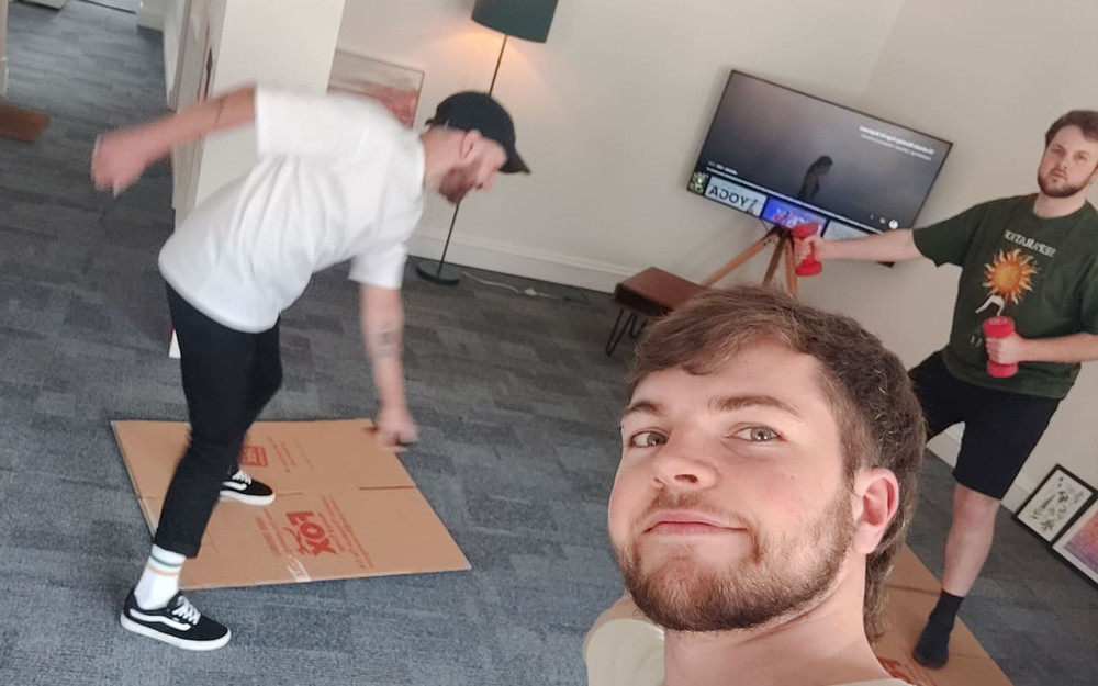 Harry, James and Nathan enjoying yoga in the office